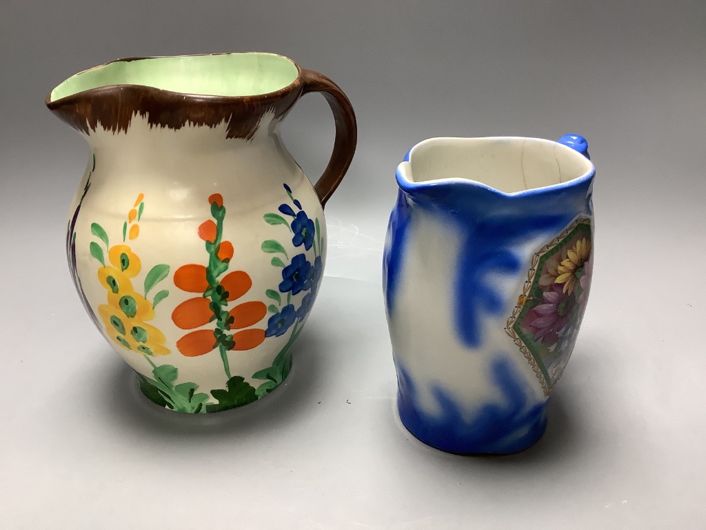 A Burleigh 'Earth laughs' jug, a majolica jug, a Wade heath jug, a Handleys jug and a salt cellar